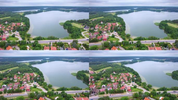 欧洲有树林和湖泊的乡村。大湖和绿色森林的戏剧性鸟瞰图。史诗般的惊人的自然景观自然保护区。波兰村壮观美