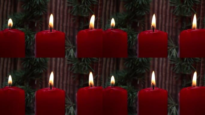 红色圣诞蜡烛灯在木质背景下燃烧