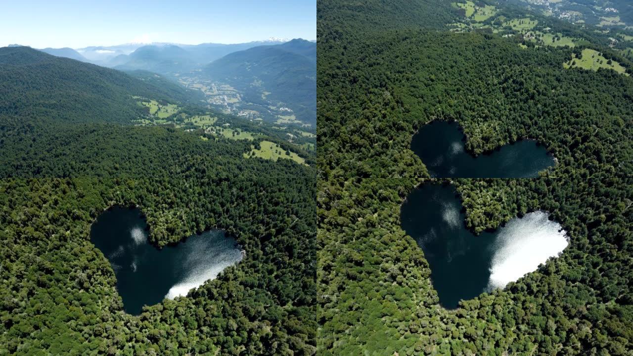 Crane镜头以全景方式展示了背景中的villarrica火山和末端的心形泻湖-无人机镜头