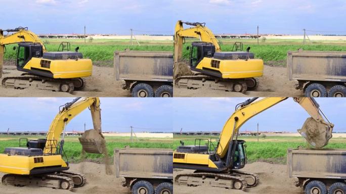 黄色挖掘机在道路施工现场进行平整工作，并将多余的沙子装载到轮式卡车中