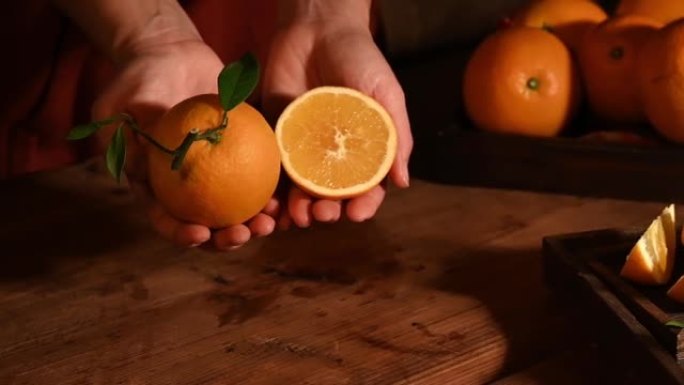 黑暗的光线环境显示用刀切割的橘子