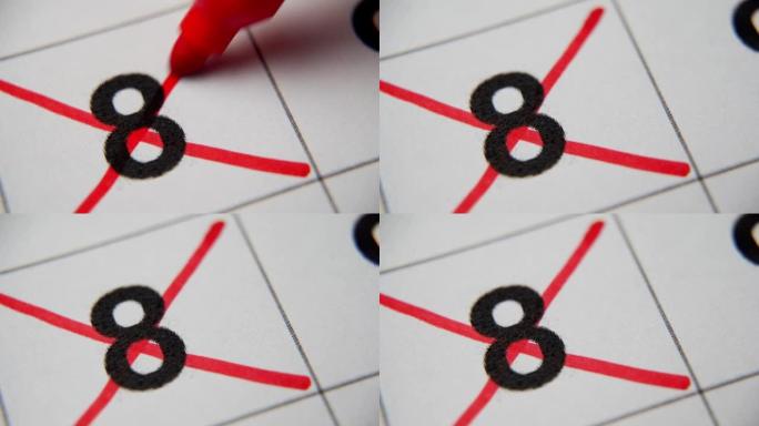 日历中的第8个数字在白纸上的宏中用红叉划掉。计划、笔记、会议日历。商业日历。日历中注释的标记。