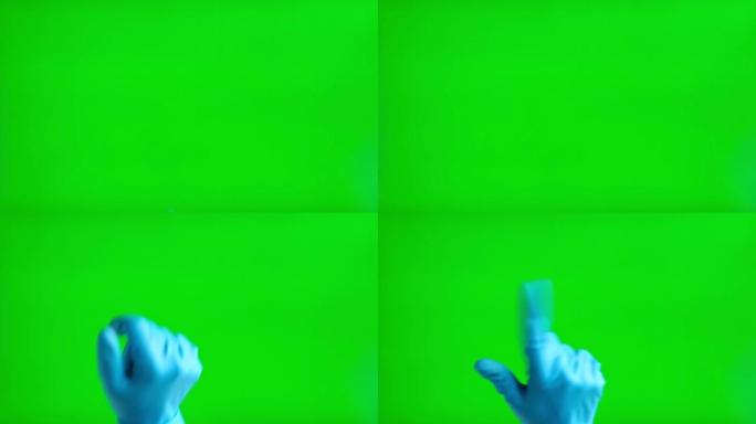 手势包。在chromakey绿色屏幕上触摸、点击和滑动医用手套。放大，缩小。特写。4k镜头。使用智能
