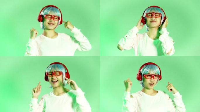 Metaverse音乐世界概念，年轻的亚洲女子戴着白色眼镜和红色耳机在绿色背景上听muusic和da