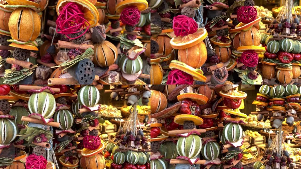 香精的调味料在展会柜台上的螺纹上悬挂各种干果和蔬菜的红色黄色散发出令人愉悦的气味