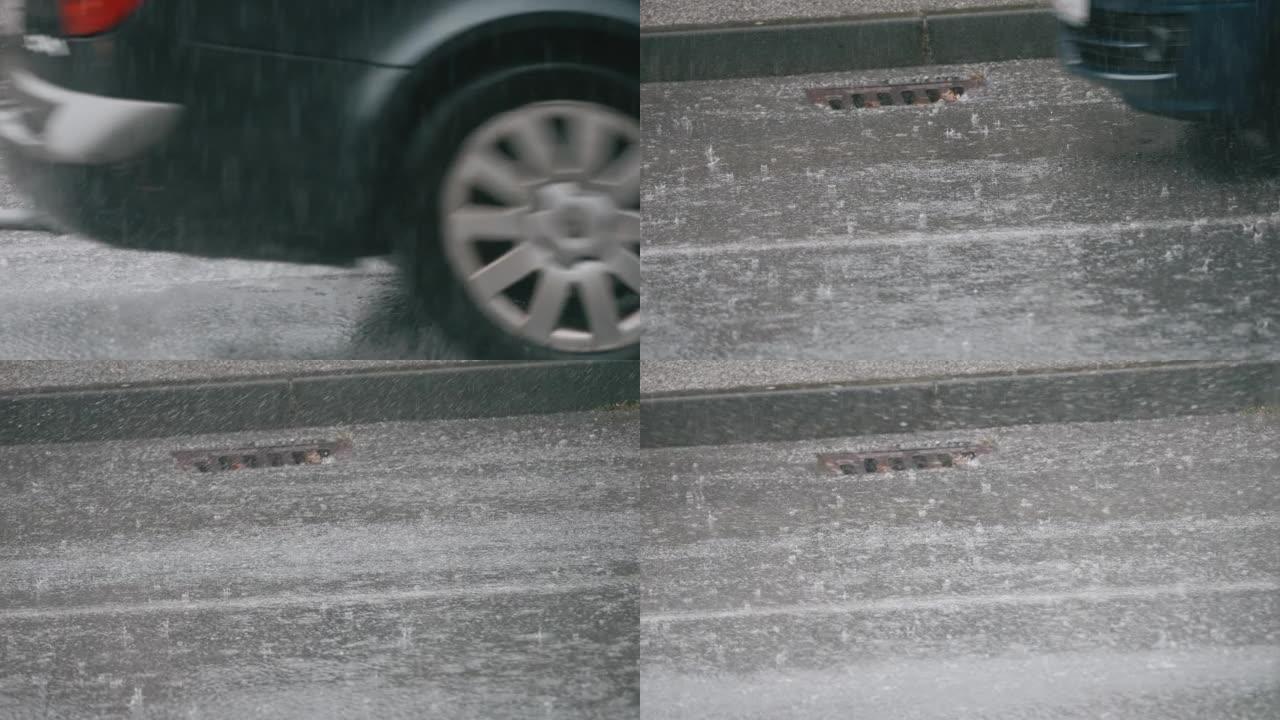暴雨下马路上的人孔特写镜头和路过的汽车
