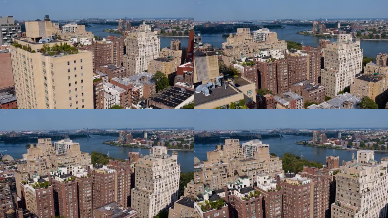 RFK桥和地狱门桥从曼哈顿上东区可以从东河远眺。带有正向上升摄像机运动的航拍视频。