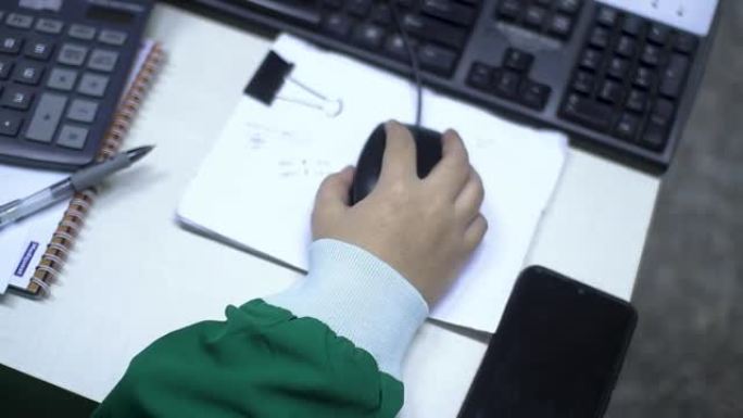 Close up of hands at work holding computer mouse