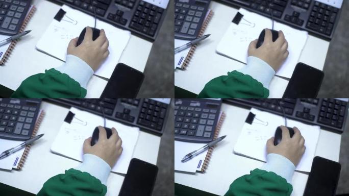 Close up of hands at work holding computer mouse