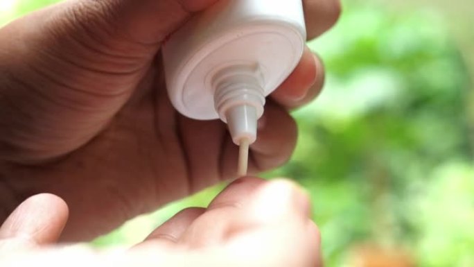 Close up of sunscreen cream on hand