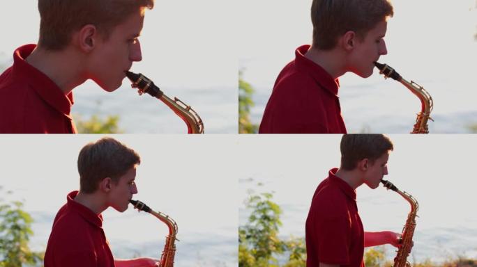 日落时，一个年轻人在河岸附近演奏萨克斯管。