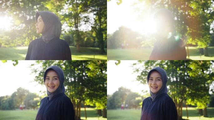 肖像运动员穆斯林妇女戴着头巾，在大自然中跑步后微笑。