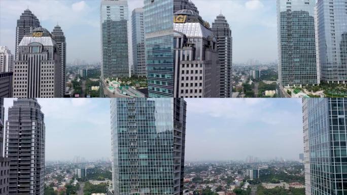 雅加达-印度尼西亚。2022年5月20日: 无人机飞越摩天大楼窗户。现代化办公楼，鸟瞰图。带有商务中