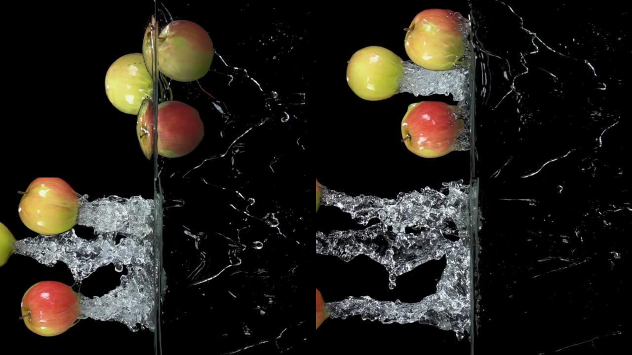 三个红绿色的苹果从水中水平弹跳，飞溅