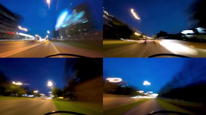 骑自行车沿着灯光模糊的夜城行驶。4k超流视频素材