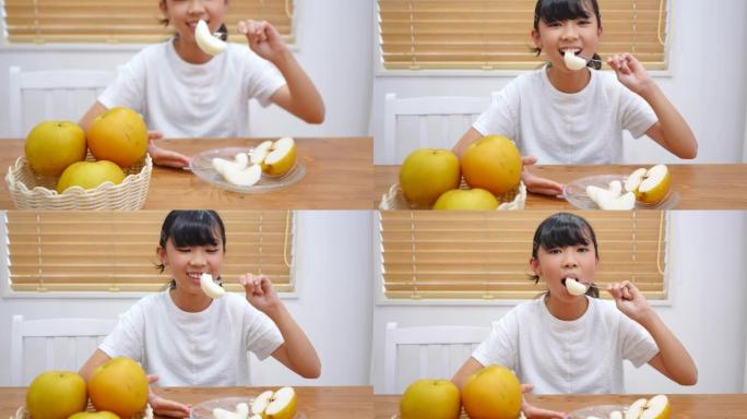 亚洲女孩在家吃梨