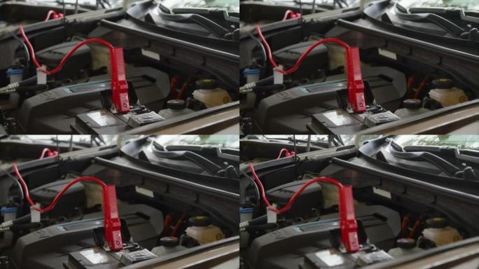 用起动机电缆连接到电池上的电池启动汽车