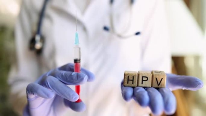 医生手中的注射器HPV病毒疫苗