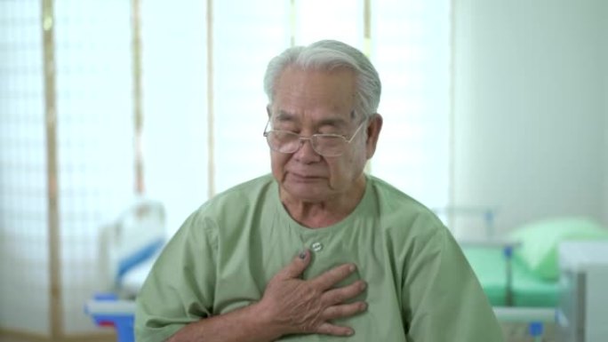 身体不适的亚洲老人有咳嗽。