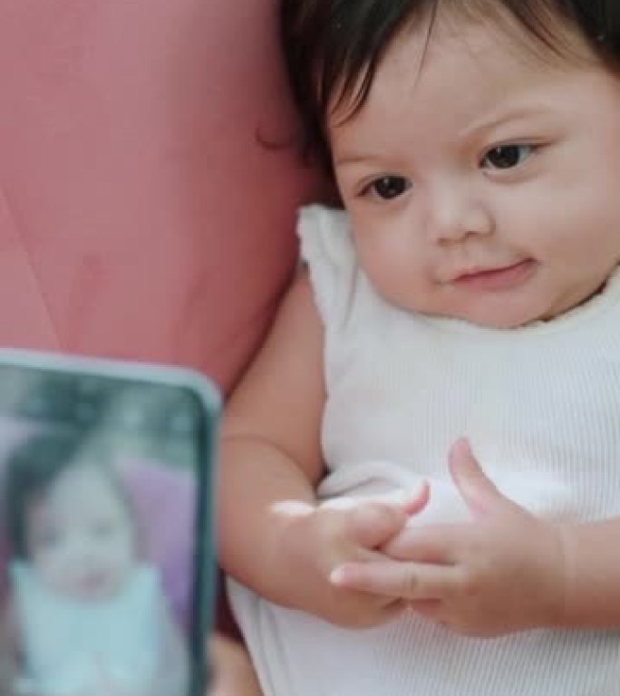 。用智能手机技术为婴儿拍照，用于社交媒体和移动应用