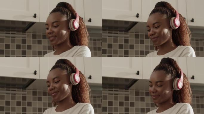 Black housewife listening to music