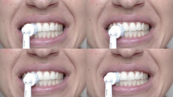 女人用电动牙刷清洁牙齿特写嘴