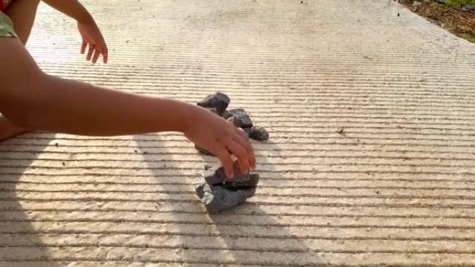 Footage of childrens game of arranging stones