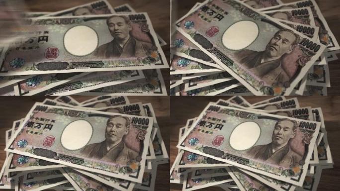日元10000钞票落在桌子上