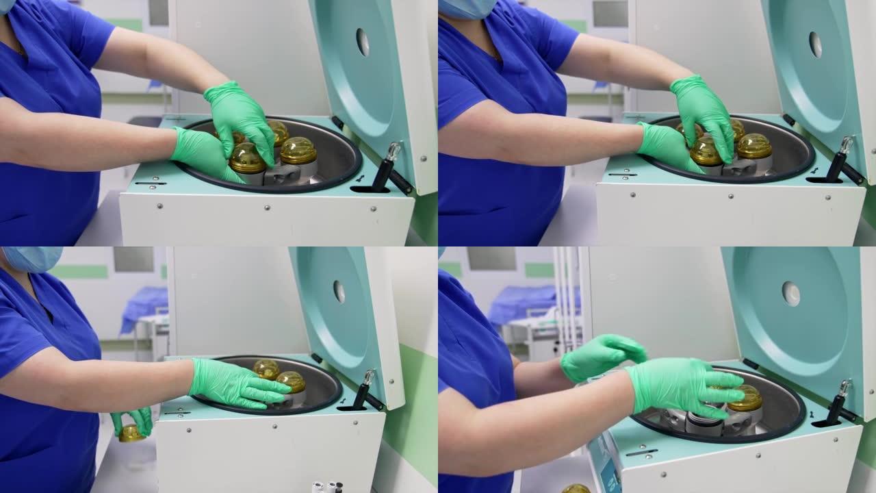 戴着手套的女护士在器械上打开一个小储液罐。Medic用接收的血浆提取试管。