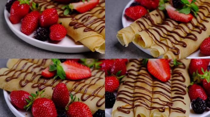 旋转可丽饼卷配巧克力，草莓和黑莓