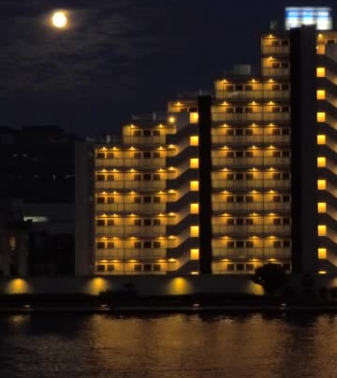 Rising of moon above the residential buildings