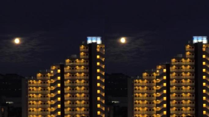 Rising of moon above the residential buildings