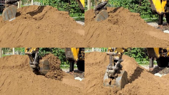 挖掘机挖入地面的近距离观察