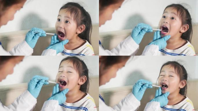 医生检查小孩的口腔使用口腔镜检查牙齿腔