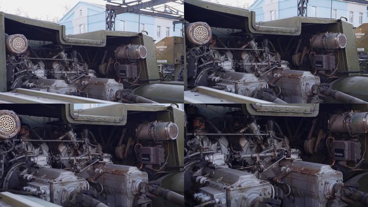一辆老式军用拖拉机的内部零件和发动机。在旧军车的停车场拍摄