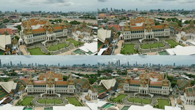 4k电影般的城市无人机镜头，在阳光明媚的日子里鸟瞰泰国曼谷老城区中心雄伟的大皇宫。
