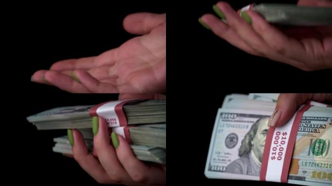 一个女孩手中的一百美元钞票，重新提款