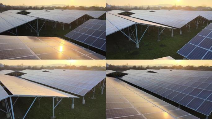 大型可持续发电厂的鸟瞰图，带有成排的太阳能光伏板，用于生产清洁的生态电能。零排放概念的可再生电力。