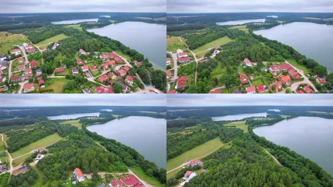 欧洲有树林和湖泊的乡村。大湖和绿色森林的戏剧性鸟瞰图。史诗般的惊人的自然景观自然保护区。波兰村壮观美