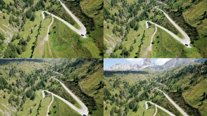 意大利阿尔卑斯山令人惊叹的背景风景的令人惊叹的山蜿蜒道路的鸟瞰图