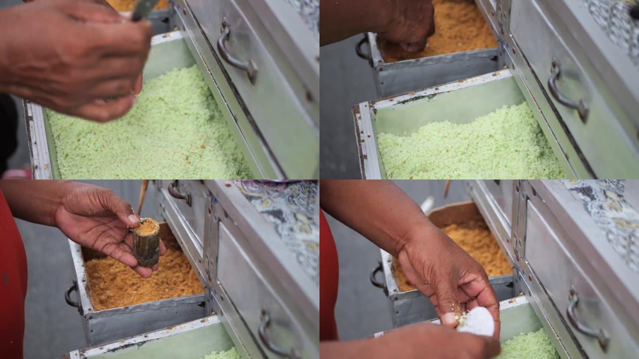 制作传统印尼小吃摊的过程，kue putu bambu。用米粉制成，用竹模制成。烹饪的哨声和香兰香气