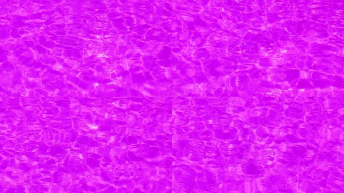 散焦模糊透明紫色清晰平静的水面纹理，带有飞溅和气泡。时尚抽象自然背景。阳光中的水波。紫水闪亮背景。