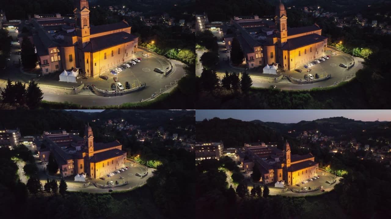 意大利博洛尼亚市博斯科圣米歇尔教堂的空中无人机日落场景