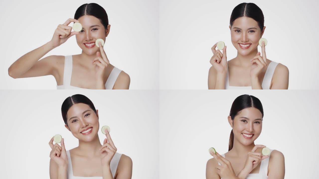 可爱的女模特干净新鲜的皮肤拿着黄瓜切片。