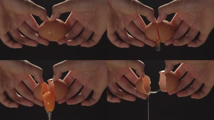 慢动作拍摄女性双手握着一个破裂的鸡蛋，打破一个鸡蛋，黑色背景。