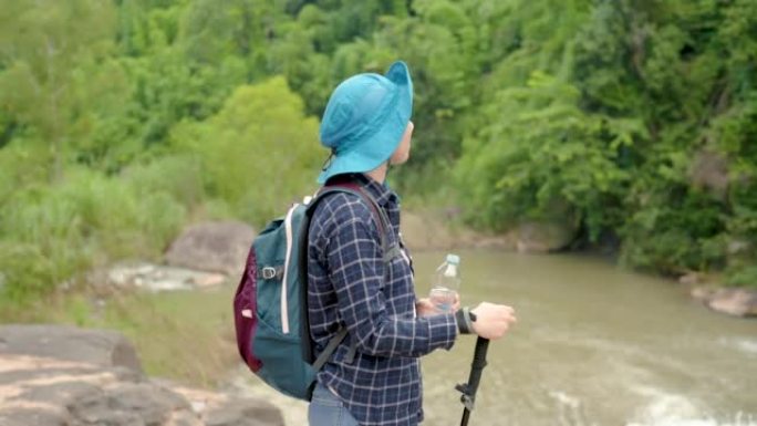 4K, An Asian trekking tourist, a woman stands at a