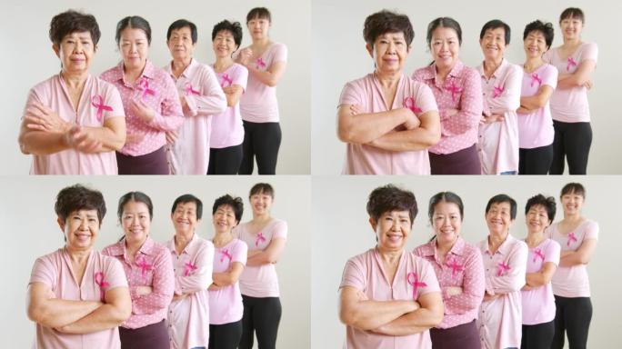 穿着粉色衬衫和粉色丝带的亚洲多年龄女性力量10月乳腺癌宣传月