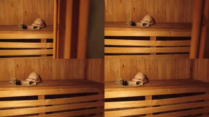 传统的老俄罗斯浴室水疗概念。内部细节芬兰桑拿蒸汽房配有传统桑拿配件套装盆毛巾芳香油勺毡。放松乡村沐浴