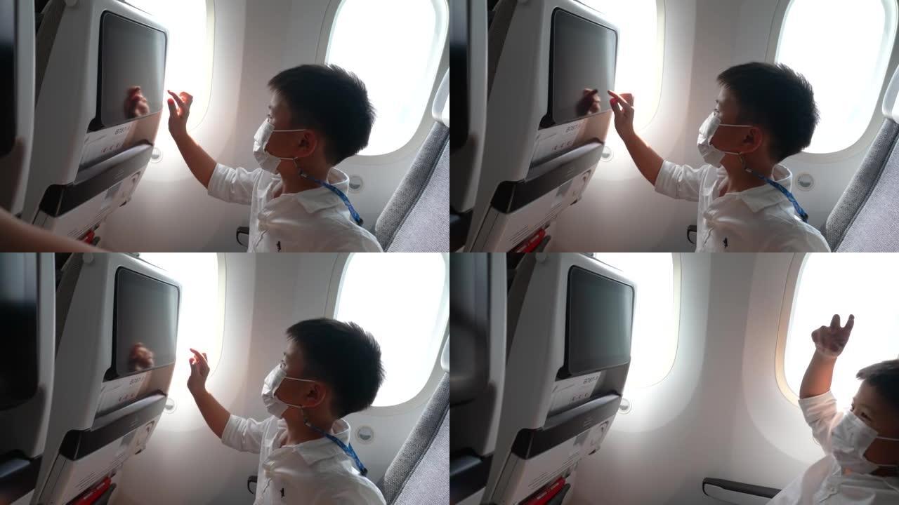 亚洲男孩在飞机上玩飞机玩具