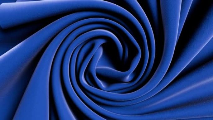 抽象蓝色彩色布皱缩并以圆形图案转动